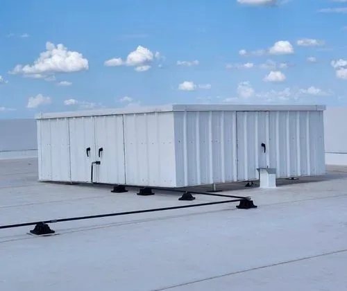 Commercial rooftop with RTU screens and HVAC equipment on a flat roof